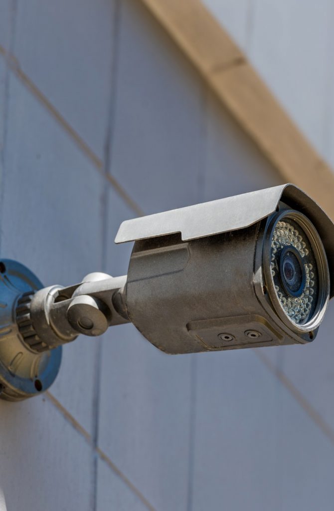 close up of security camera on wall, security system concept